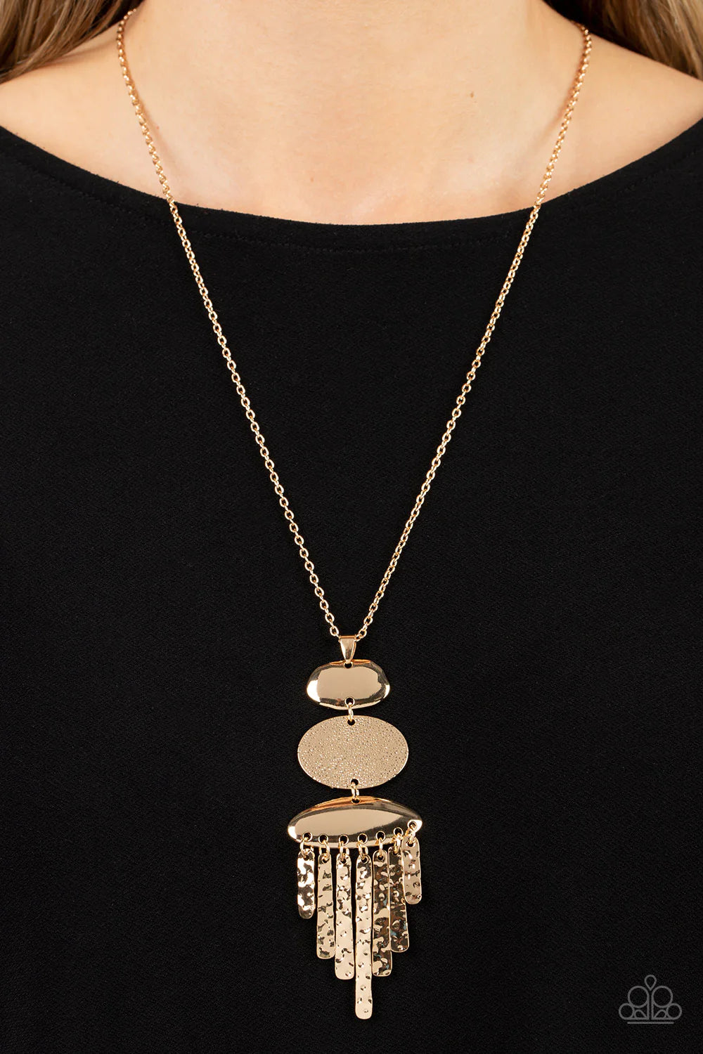 Paparazzi Accessories After the ARTIFACT - Gold A hammered gold oval frame is flanked between two asymmetrical gold frames at the bottom of a lengthened gold chain. Hammered gold pendulums swing from the bottom of the stacked pendant, adding playful movem