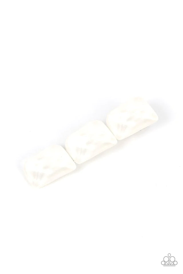 Paparazzi Accessories Gemstone Glimmer - White Enhanced with veins of light, a faceted collection of white faux gemstone beads embellishes the front of a classic silver frame for a tranquil fashion. Features a standard hair clip on the back. Hair Accessor
