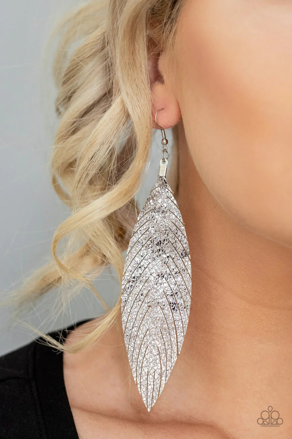 Paparazzi Accessories Feather Fantasy - Multi Brushed in a shimmery metallic finish, a flat leather feather frame swings from the ear for a statement-making finish. Earring attaches to a standard fishhook fitting. Sold as one pair of earrings. Jewelry