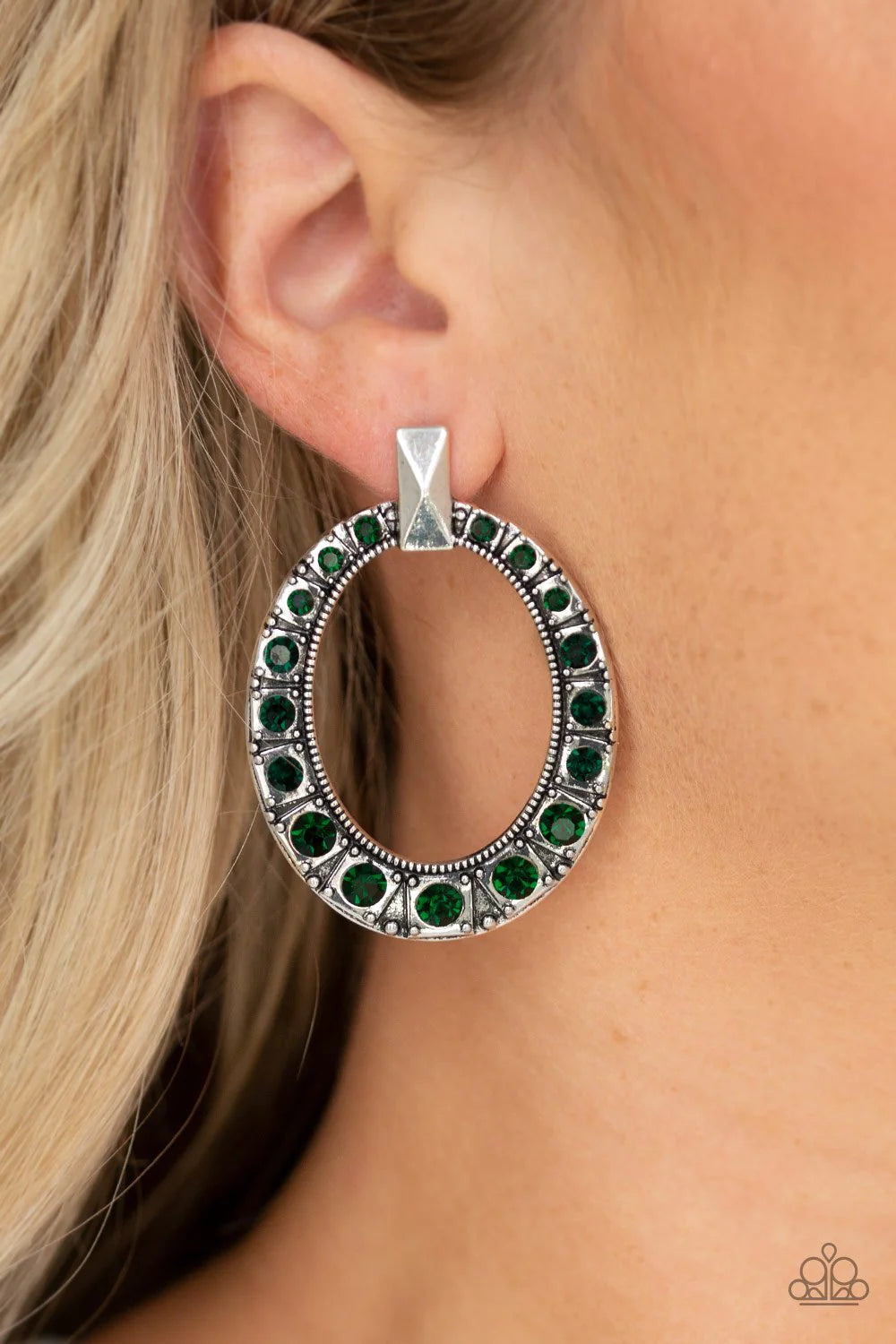 Paparazzi Accessories All For Glow - Green Featuring a faceted silver fitting, a beveled silver hoop is encrusted in glittery green rhinestones that gradually increase near the bottom of the ornate frame for an edgy finish. Earring attaches to a standard
