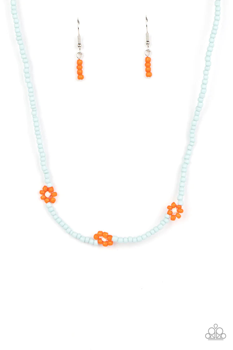 Paparazzi Accessories Bewitching Beading - Orange Strung along the entirety of an invisible wire, light blue seed beads coalesce around the collar. The row of blue seed beads are haphazardly interrupted by blooming orange seed bead flowers, with baby pink