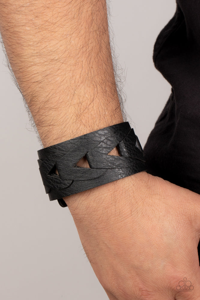 Paparazzi Accessories Horse and Carriage - Black Featuring airy triangular cutouts, black leather links interlock across the center of a distressed black leather band for a rustic flair. Features an adjustable snap closure. Sold as one individual bracelet