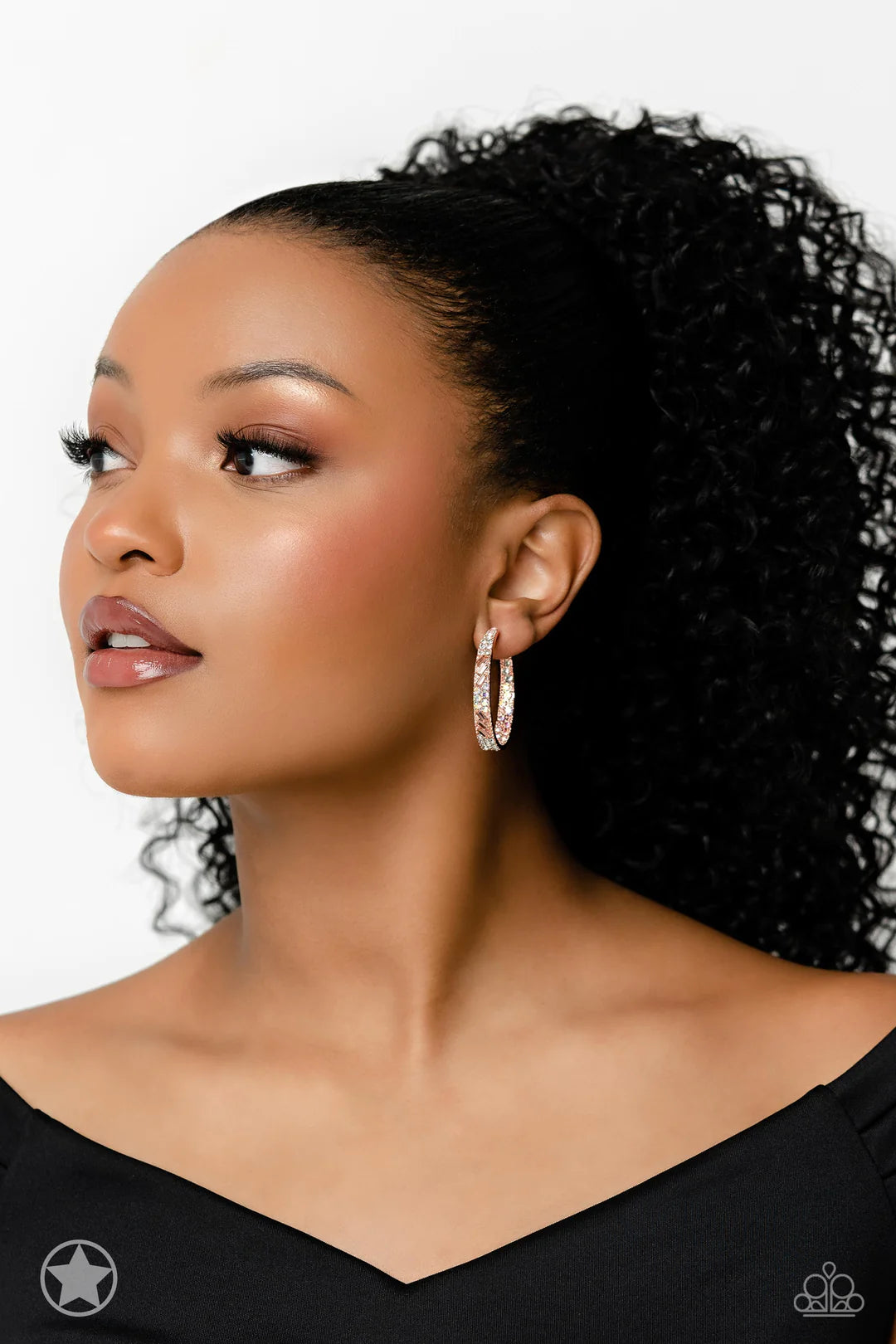 Paparazzi Accessories Glitzy by Association - Copper The front facing surface of a chunky shiny copper hoop is dipped in brilliantly sparkling iridescent, peach, and white rhinestones while light-catching texture wraps around the back. The interior of the