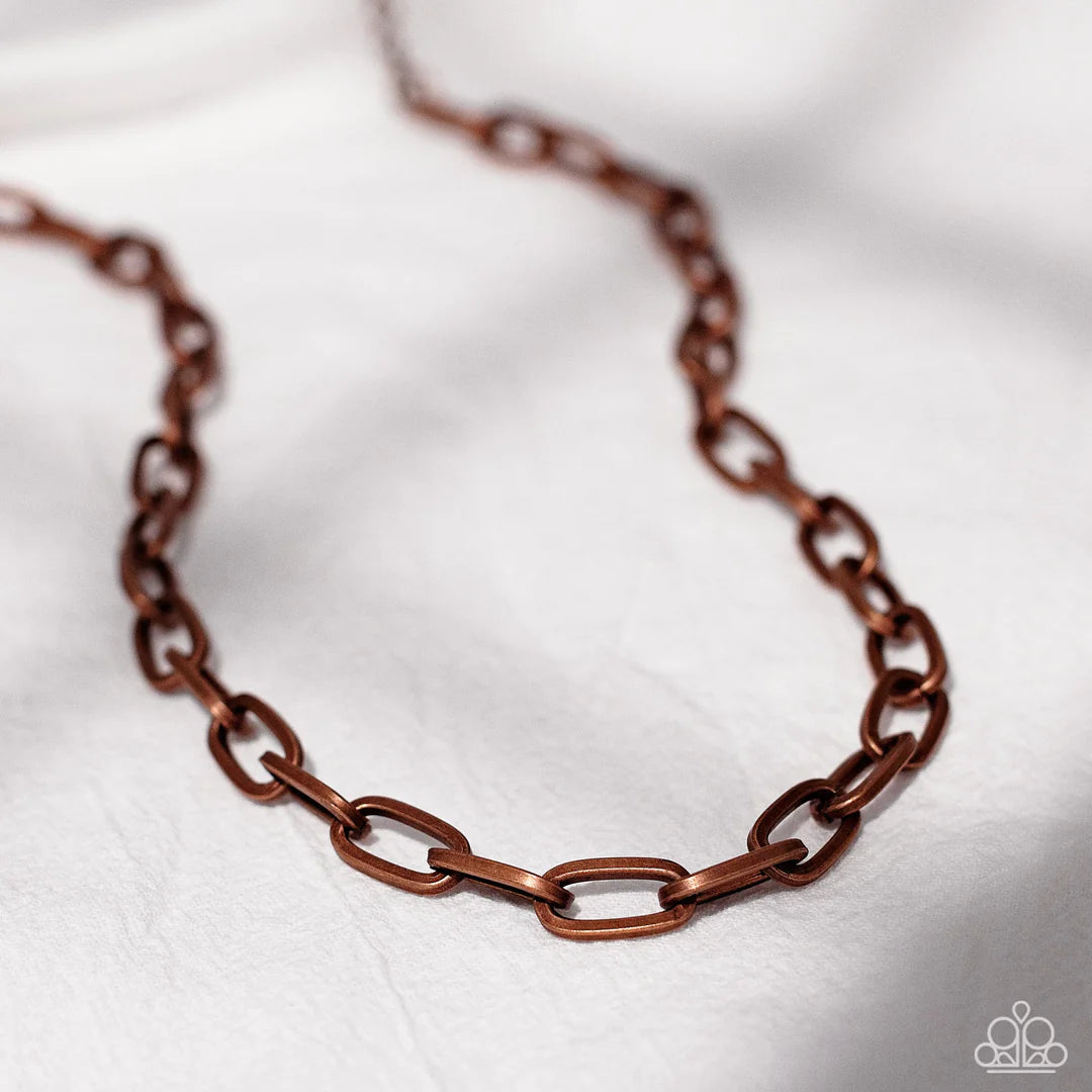 Paparazzi Accessories Boston Backdrop - Copper A strand of oversized, copper, chain links falls unapologetically along the collar. The timeless palette takes on an industrial intensity, allowing the simple design to make an impressive impact. Features an
