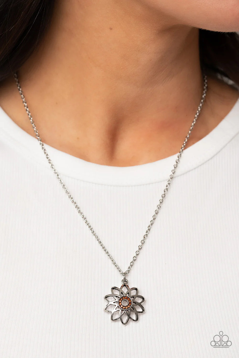 Paparazzi Accessories Farmstead Fairytale - Brown Beveled silver frames fan out from a dainty ring of glitzy topaz rhinestones, blooming into an airy floral pendant at the bottom of a dainty silver chain. Features an adjustable clasp closure. Sold as one