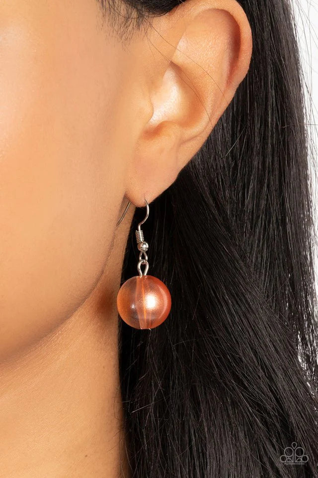 Paparazzi Accessories Marina Mirage - Orange Lightly brushed in a pearly Spun Sugar shimmer, glassy translucent beads gradually increase in size as they are threaded along an invisible wire below the collar. Textured silver rings separate the largest bead