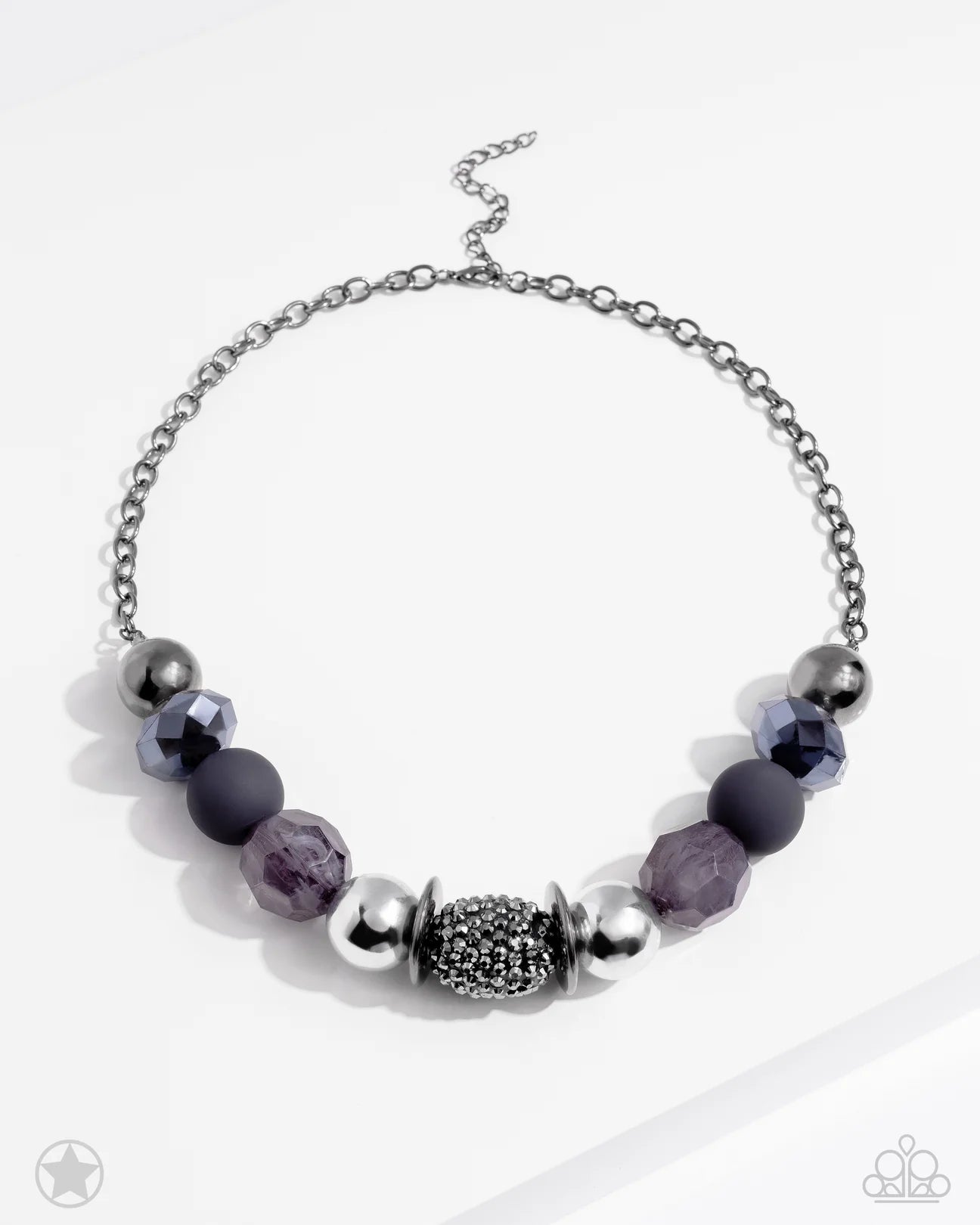 Paparazzi Accessories A Warm Welcome - Black Sophisticated beads in shades of gunmetal and black with reflective faceted edges and varying glazed finishes are offset by two shiny silver beads. An oblong bead studded with gunmetal rhinestones adds a dramat