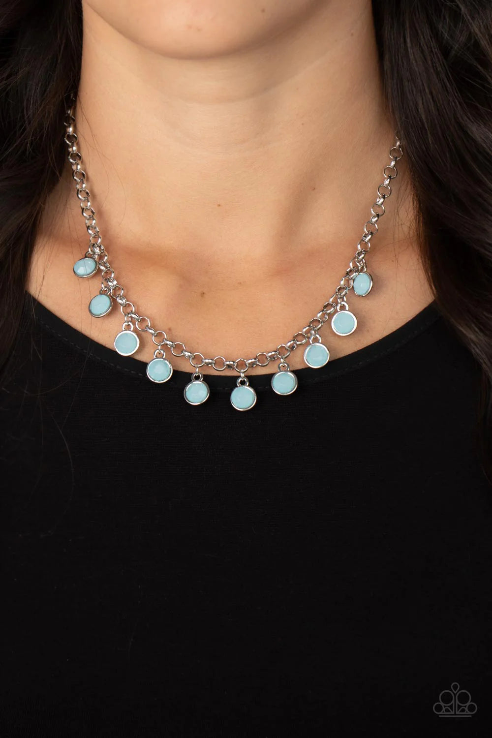 Paparazzi Accessories Moonbeam Magic - Blue Featuring a milky shimmer, opaque Spun Sugar crystal-like beads are pressed into simple silver settings as they dance below the collar for a colorfully carefree look. Features an adjustable clasp closure. Sold a