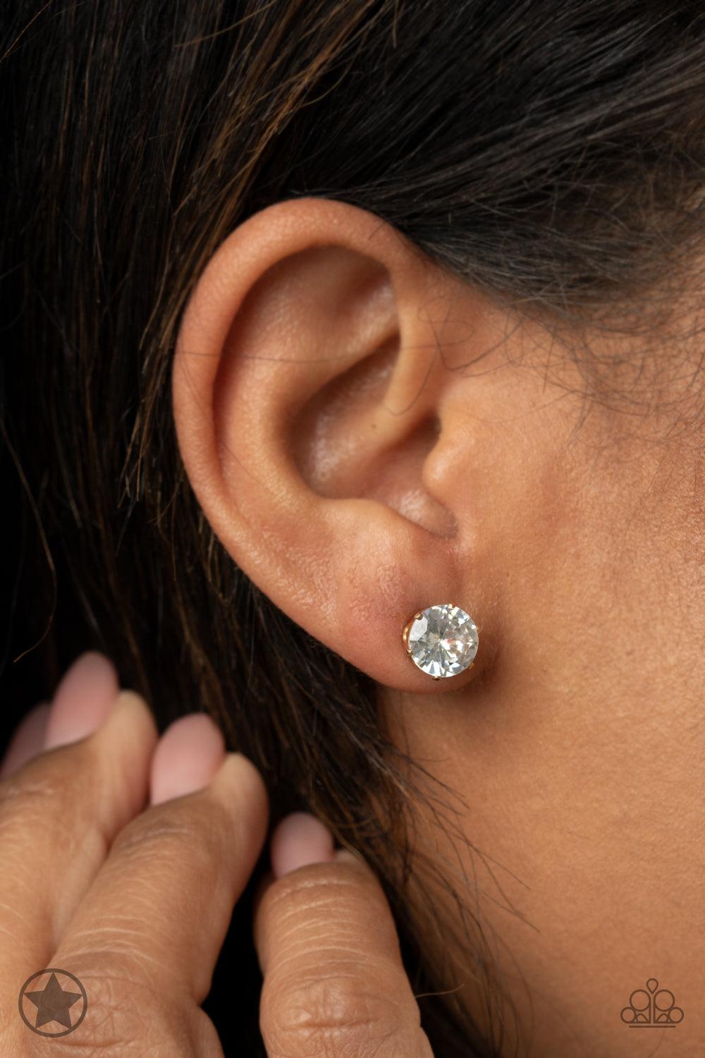 Paparazzi Accessories Just In TIMELESS - Gold A sparkling white rhinestone is nestled inside a classic gold frame for a timeless look. Earring attaches to a standard post fitting. Sold as one pair of post earrings. Jewelry