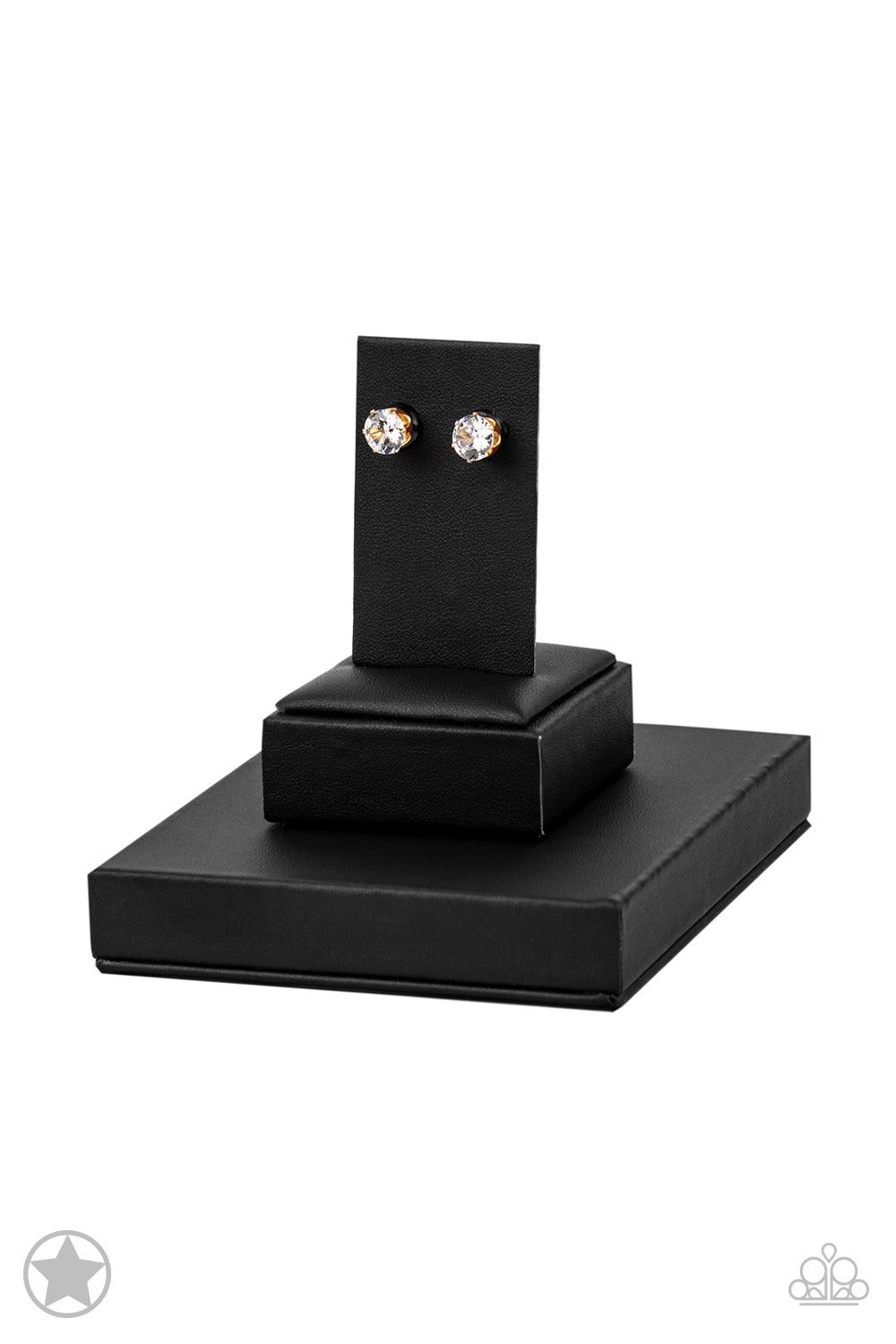 Paparazzi Accessories Just In TIMELESS - Gold A sparkling white rhinestone is nestled inside a classic gold frame for a timeless look. Earring attaches to a standard post fitting. Sold as one pair of post earrings. Jewelry