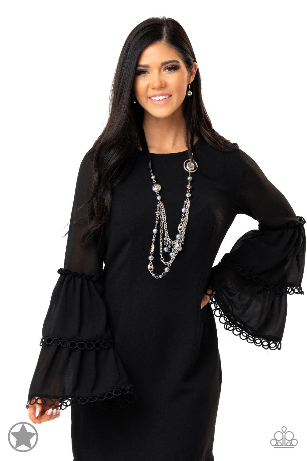Paparazzi Accessories All The Trimmings - Black A silky black ribbon replaces a traditional chain to create a timeless look. Pearly dark gray beads and funky silver pieces intermix with varying lengths of silver chains to give a fresh take on a Victorian-