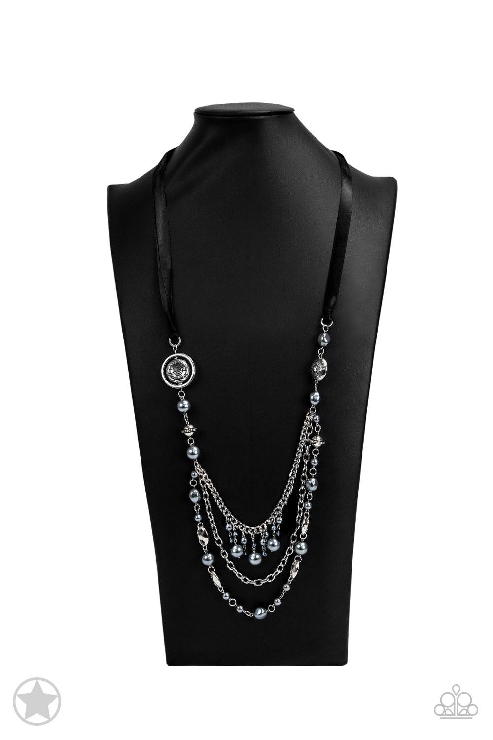 Paparazzi Accessories All The Trimmings - Black A silky black ribbon replaces a traditional chain to create a timeless look. Pearly dark gray beads and funky silver pieces intermix with varying lengths of silver chains to give a fresh take on a Victorian-