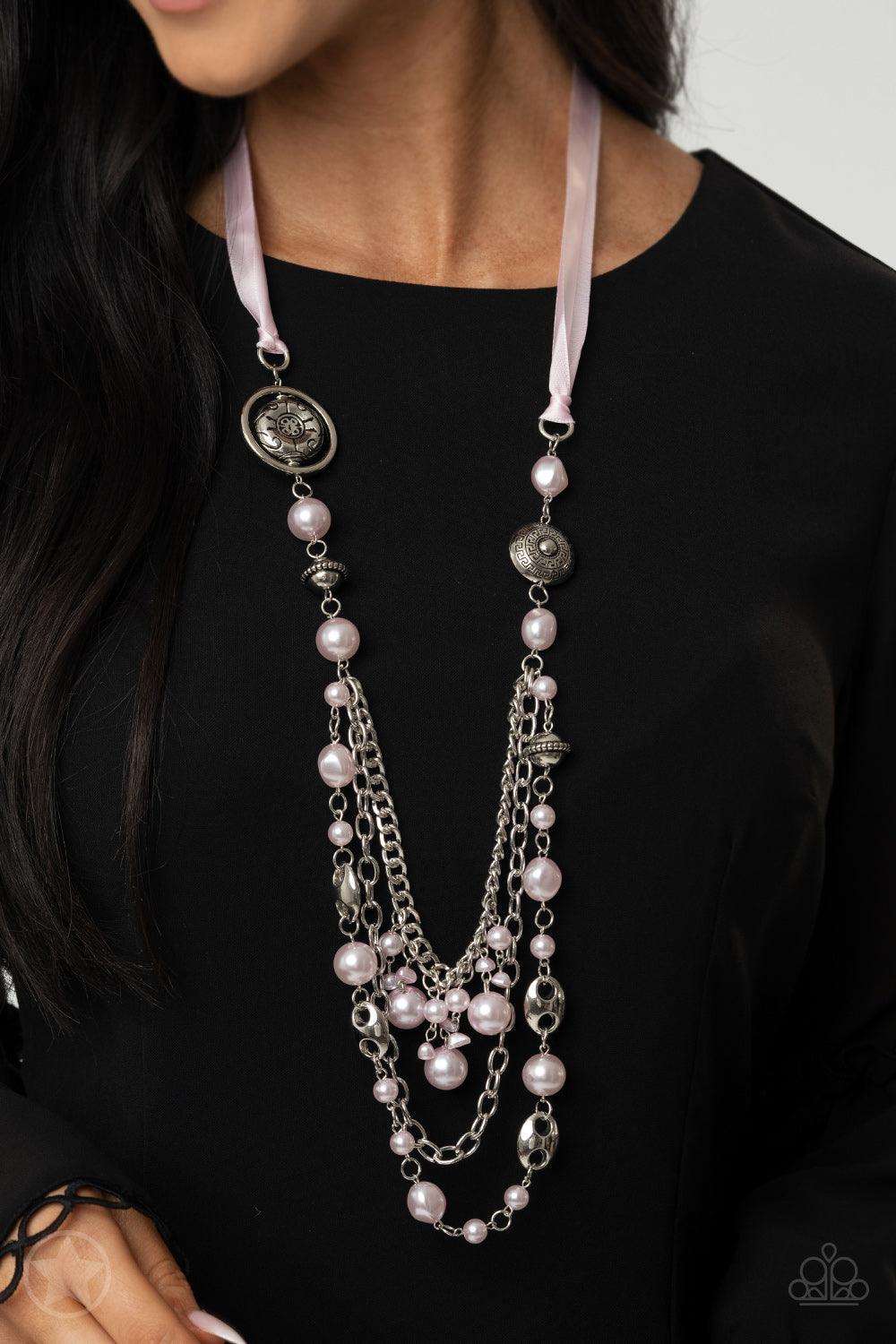 Paparazzi Accessories All The Trimmings - Pink A silky pink ribbon replaces a traditional chain to give an elegant look. Pearly pastel pink beads and funky silver pieces intermix with varying lengths of silver chains to give a fresh take on a Victorian-in