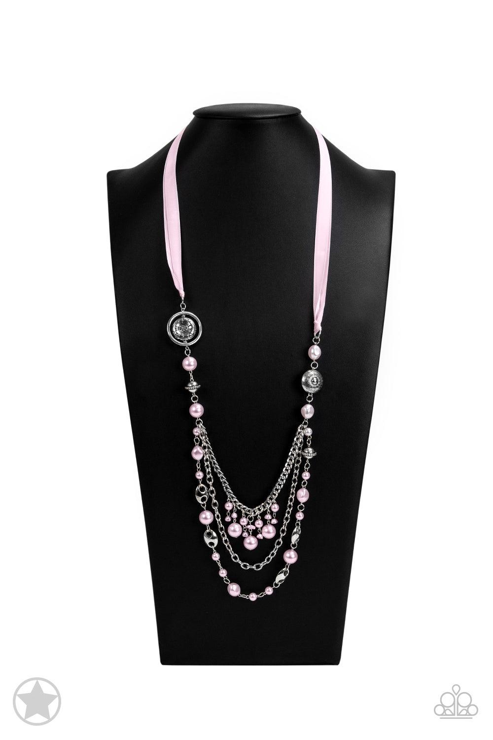 Paparazzi Accessories All The Trimmings - Pink A silky pink ribbon replaces a traditional chain to give an elegant look. Pearly pastel pink beads and funky silver pieces intermix with varying lengths of silver chains to give a fresh take on a Victorian-in