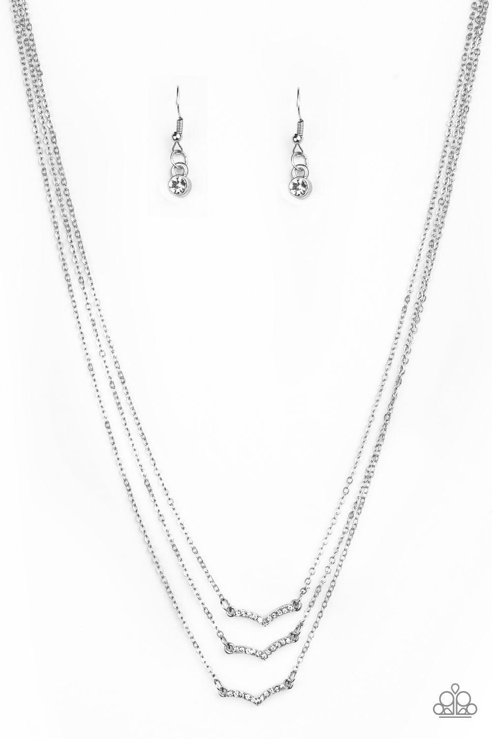 Paparazzi Accessories Pretty Petite - White Encrusted in glassy white rhinestones, three dainty silver frames layer below the collar for a classic look. Features an adjustable clasp closure. Sold as one individual necklace. Includes one pair of matching e