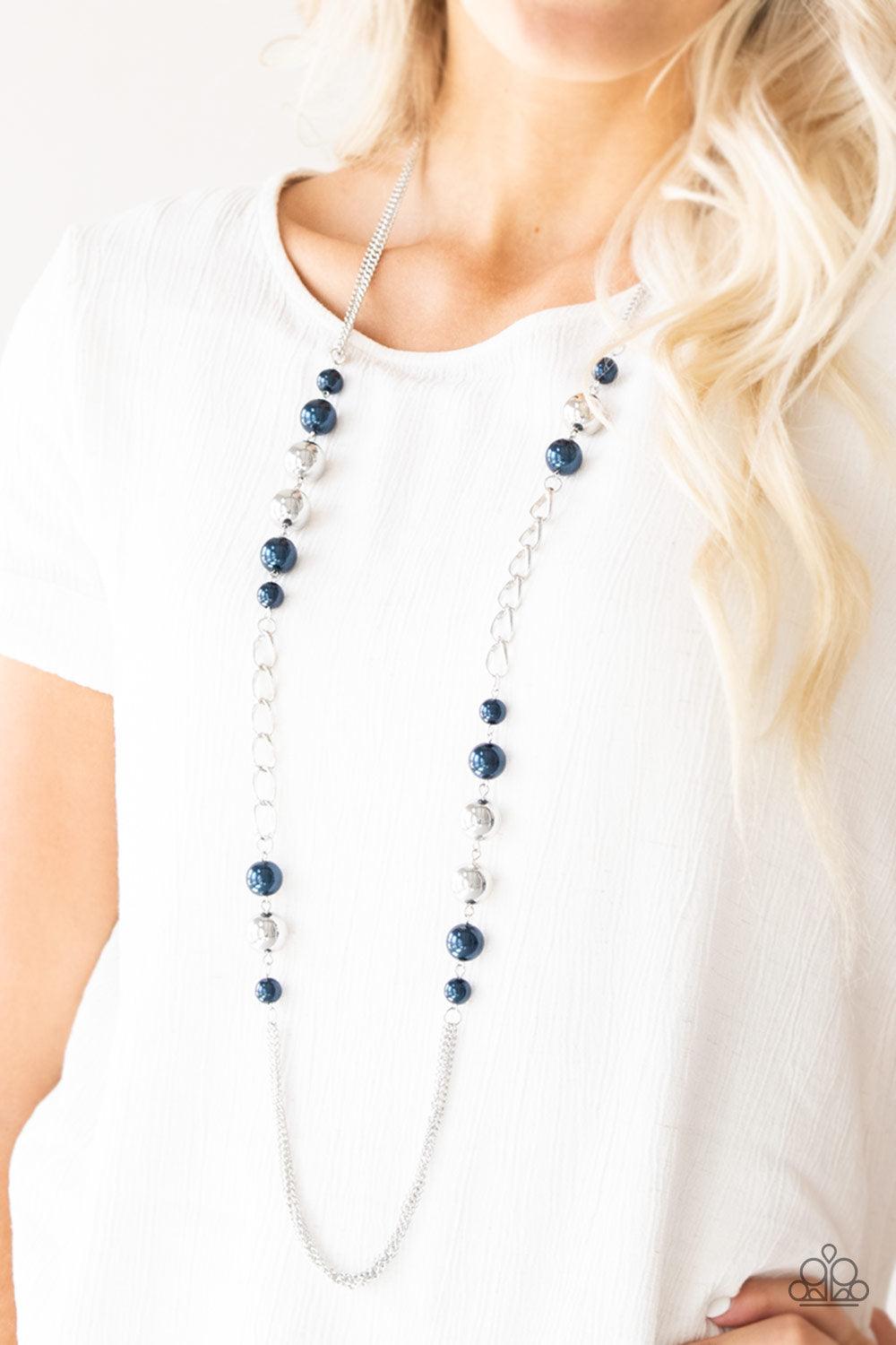Paparazzi Accessories Uptown Talker - Blue Varying in size, pearly blue and oversized silver beads give way to sections of bold silver chain. Layers of silver chains drape across the bottom of the design for a flawless finish. Features an adjustable clasp