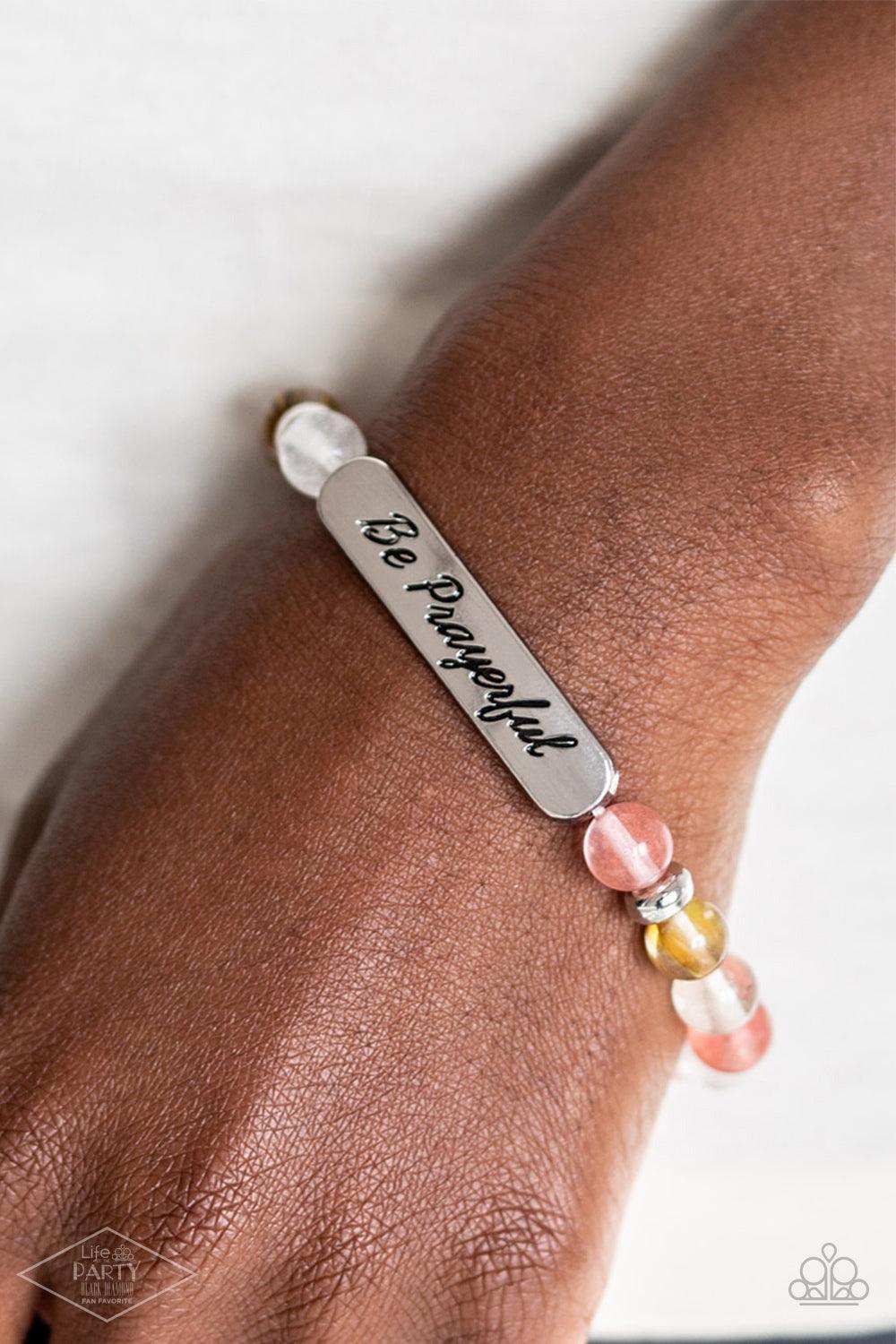 Paparazzi Accessories Be Prayerful - Multi Infused with dainty silver accents, a collection of glassy stone beads and a shimmery silver frame stamped in the phrase, "Be Prayerful", are threaded along a stretchy band around the wrist for an inspirational l