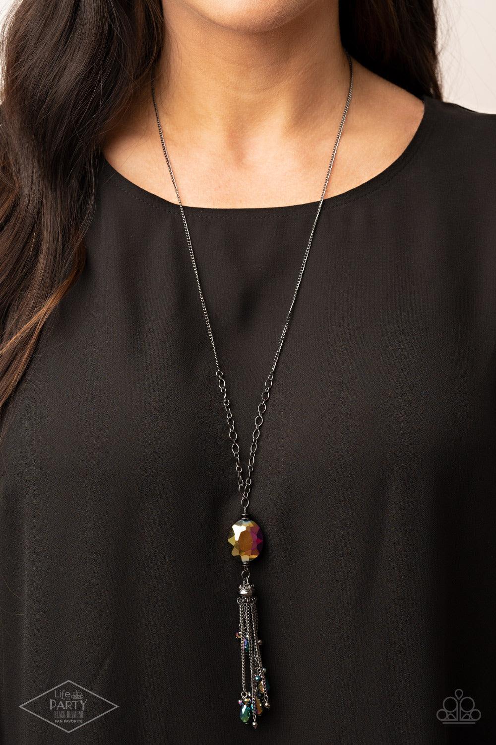Paparazzi Accessories Fringe Flavor - Multi Featuring an oil spill finish, a faceted oil spill gem attaches to the bottom of a lengthened gunmetal chain featuring sections of airy chain links. Infused with dainty gunmetal and matching oil spill beads, shi