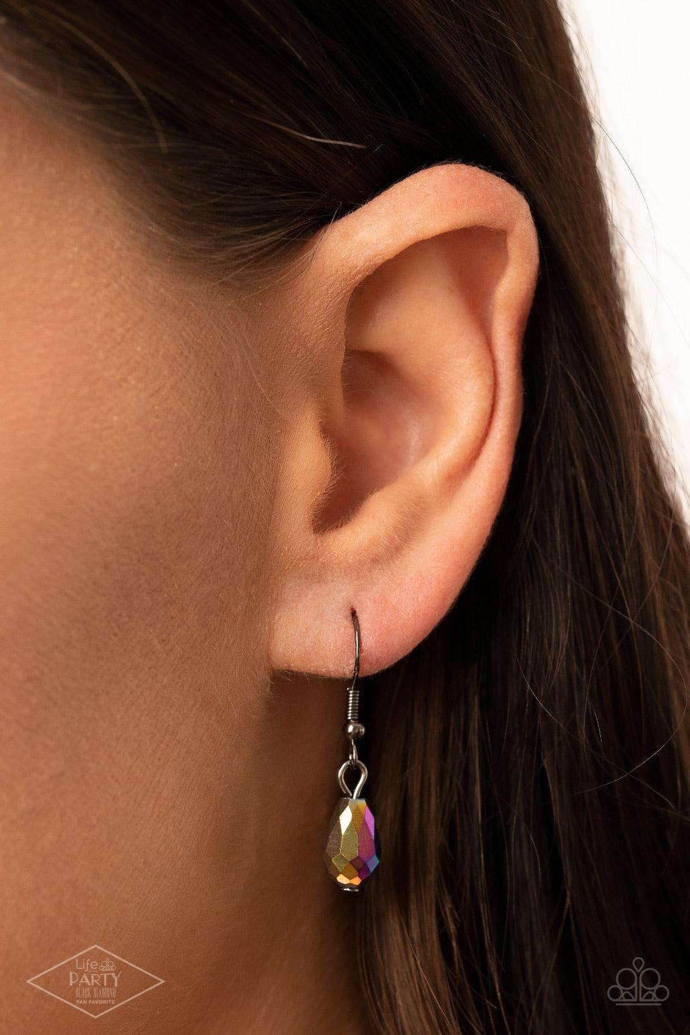 Paparazzi Accessories Fringe Flavor - Multi Featuring an oil spill finish, a faceted oil spill gem attaches to the bottom of a lengthened gunmetal chain featuring sections of airy chain links. Infused with dainty gunmetal and matching oil spill beads, shi