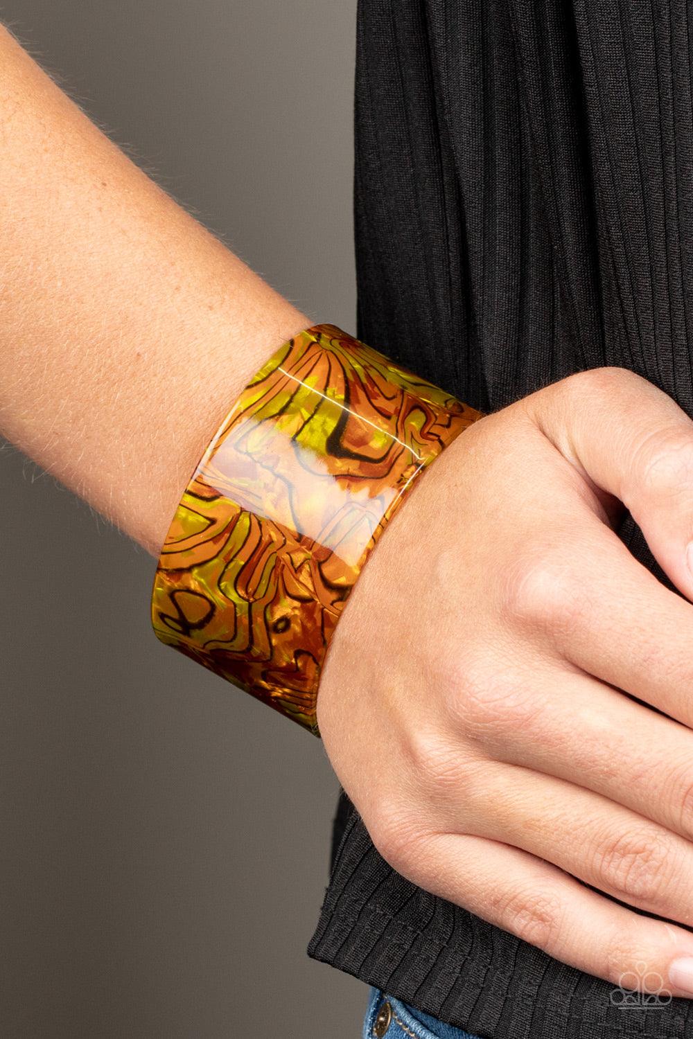 Paparazzi Accessories Cosmic Couture - Orange Featuring a retro watercolor pattern, a thick orange acrylic cuff curls around the wrist for an out-of-this-world colorful look. Sold as one individual bracelet. Jewelry