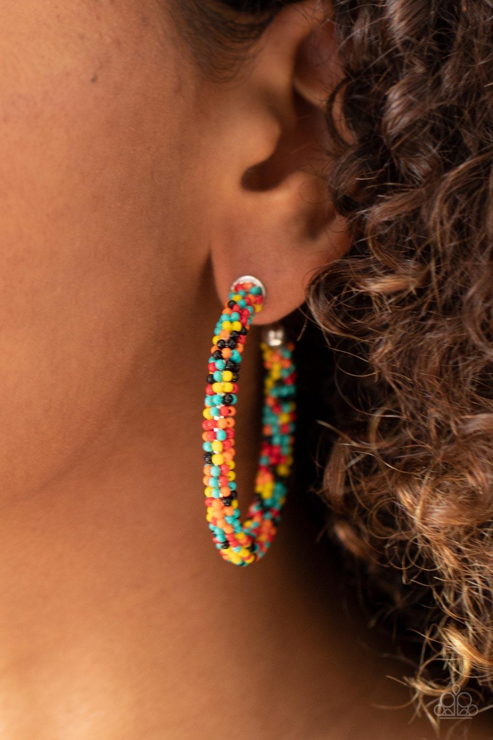 Paparazzi Accessories BEAD My Lips! - Multi A dainty collection of turquoise, black, yellow, orange, and red seed beads colorfully adorns a classic hoop for a beautifully beaded look. Earring attaches to a standard post fitting. Hoop measures approximatel