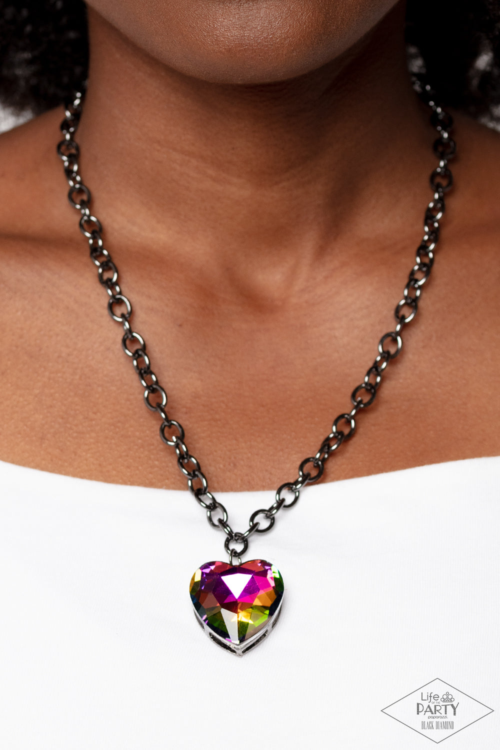 Paparazzi Accessories Flirtatiously Flashy - Multi Set atop a sleek gunmetal fitting, a glittery oil spill heart-shaped gem swings from the bottom of a classic gunmetal chain below the collar for a whimsical look. Features an adjustable clasp closure. Due