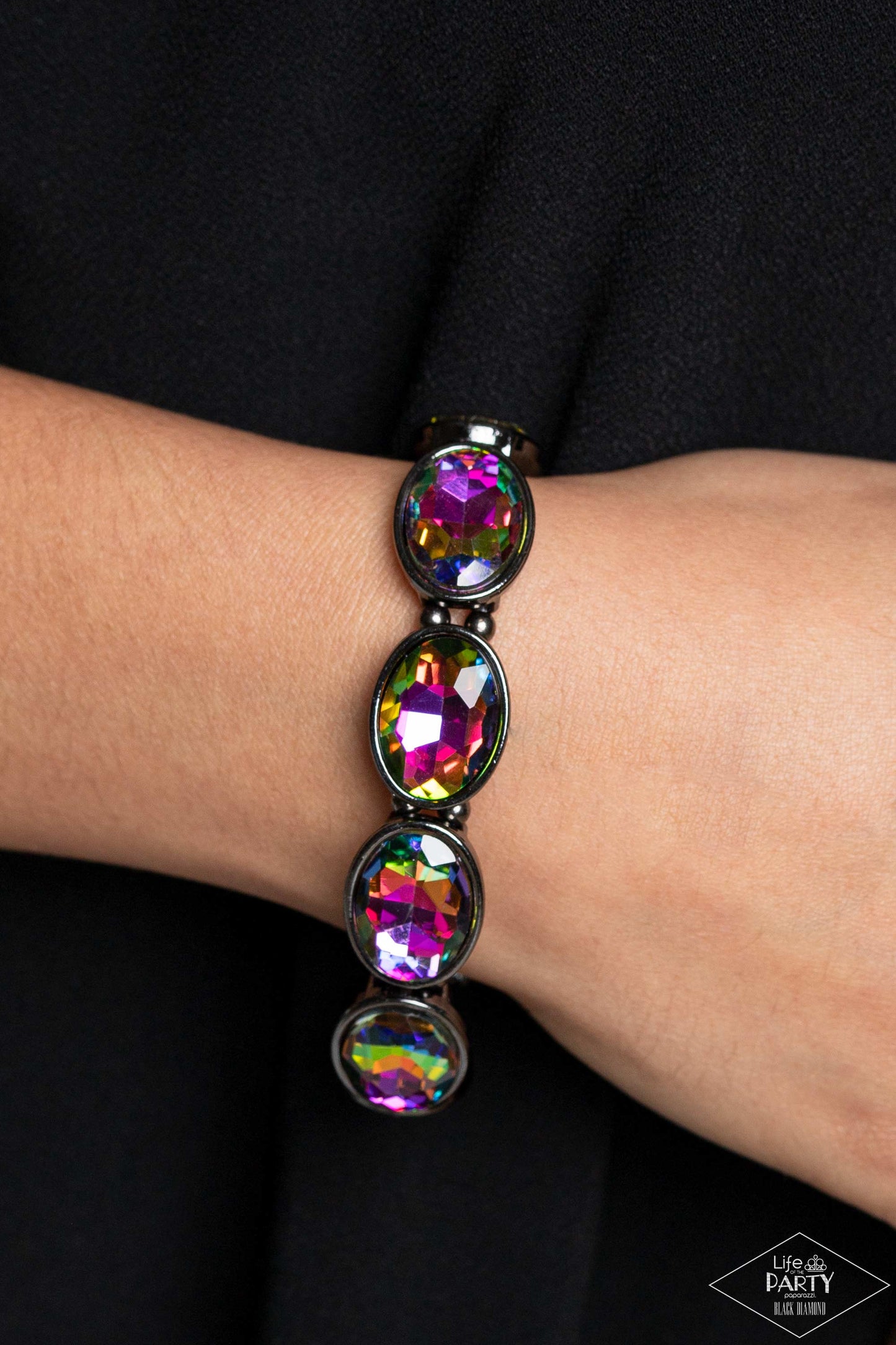 Paparazzi Accessories Diva In Disguise - Multi Glittery oil spill gems are pressed into sleek gunmetal frames. Infused with dainty gunmetal beads, the sparkly frames are threaded along stretchy bands for a glamorous look around the wrist. Sold as one indi