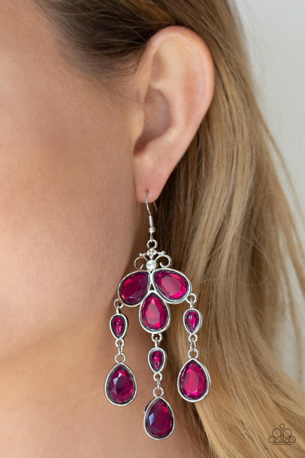 Paparazzi Accessories Clear The HEIR - Purple Featuring smooth and faceted surfaces, a glassy collection of purple teardrop crystals delicately coalesce into a whimsical chandelier. A dainty white rhinestone crowns the top of the regal display for a spark