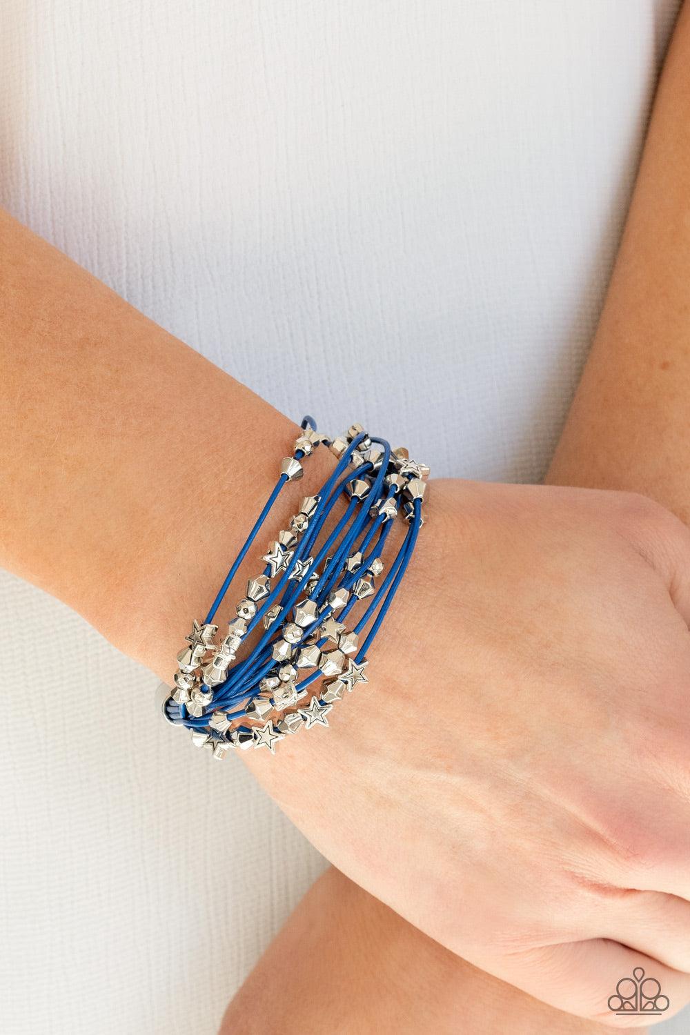Paparazzi Accessories Star-Studded Affair - Blue A collection of faceted silver beads and silver star charms slides along French Blue cords that layer across the wrist for a colorful look. Features a magnetic closure. Sold as one individual bracelet. Jewe