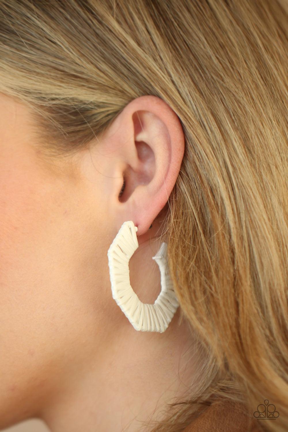 Paparazzi Accessories Fabulously Fiesta - White White wicker-like cording is wrapped around a hexagonal hoop, creating a colorful pop of color. Earring attaches to a standard post fitting. Hoop measures approximately 2" in diameter. Sold as one pair of ho