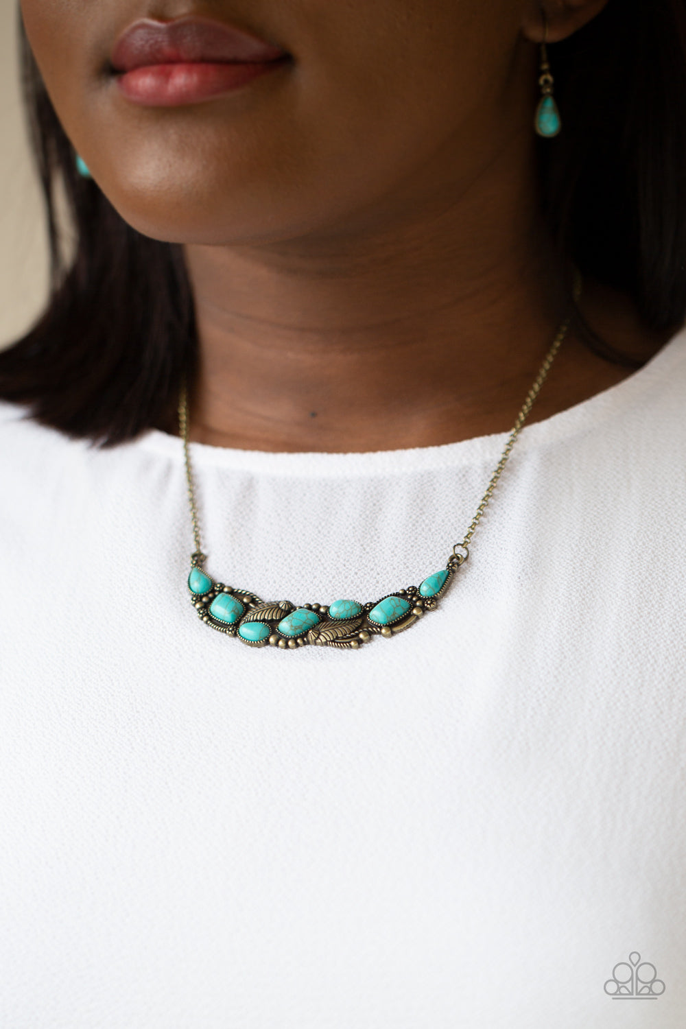 Paparazzi Accessories Cottage Garden - Brass A collection of asymmetrical turquoise stones adorns the front of a studded brass frame embossed in floral and feathery accents below the collar, creating a seasonal centerpiece. Features an adjustable clasp cl
