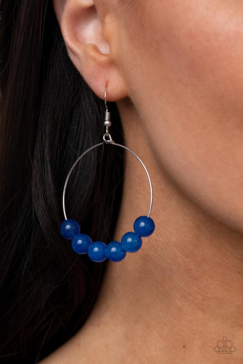 Paparazzi Accessories Let It Slide - Blue Oversized lapis lazuli stones slide along the bottom of a dainty silver hoop, creating an earthy centerpiece. Earring attaches to a standard fishhook fitting. Sold as one pair of earrings. Jewelry