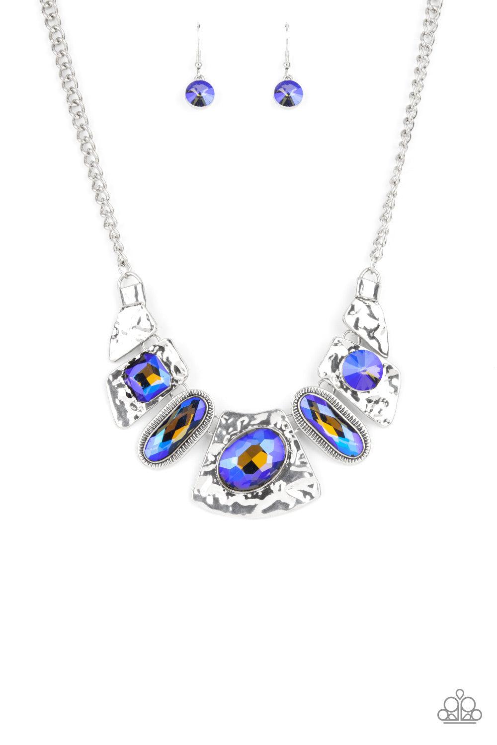 Paparazzi Accessories Futuristic Fashionista - Blue Mismatched French Blue gems adorn the front of hammered silver plates that abstractly connect below the collar, creating an out-of-this-world statement piece. Features an adjustable clasp closure. Sold a