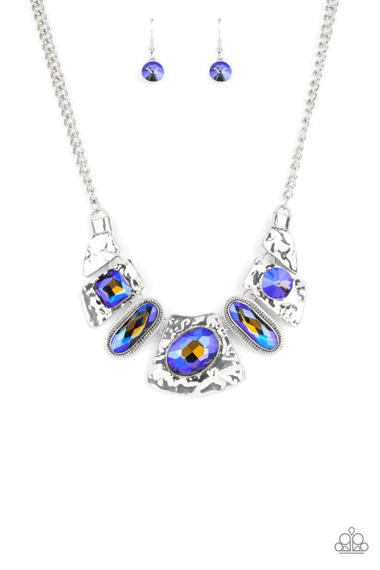 Paparazzi Accessories Futuristic Fashionista - Blue Mismatched French Blue gems adorn the front of hammered silver plates that abstractly connect below the collar, creating an out-of-this-world statement piece. Features an adjustable clasp closure. Sold a