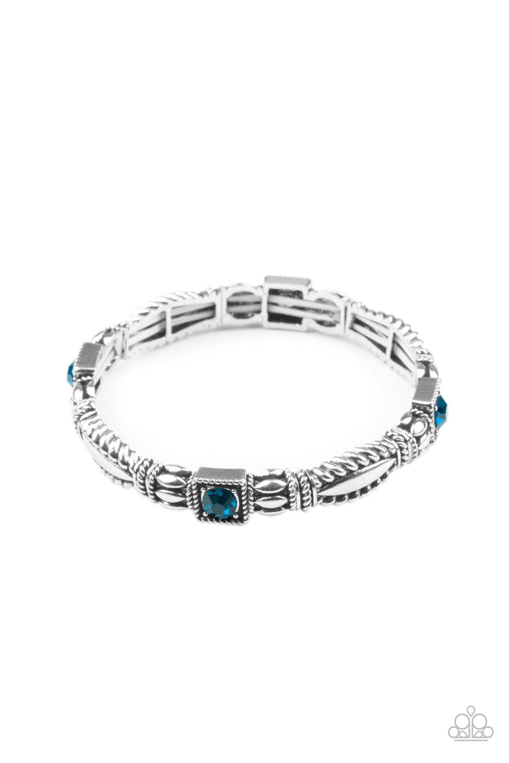 Paparazzi Accessories Get This GLOW On The Road - Blue Dotted with blue rhinestone centers, decorative silver frames are threaded along stretchy bands around the wrist, creating a colorful display. Sold as one individual bracelet. Jewelry