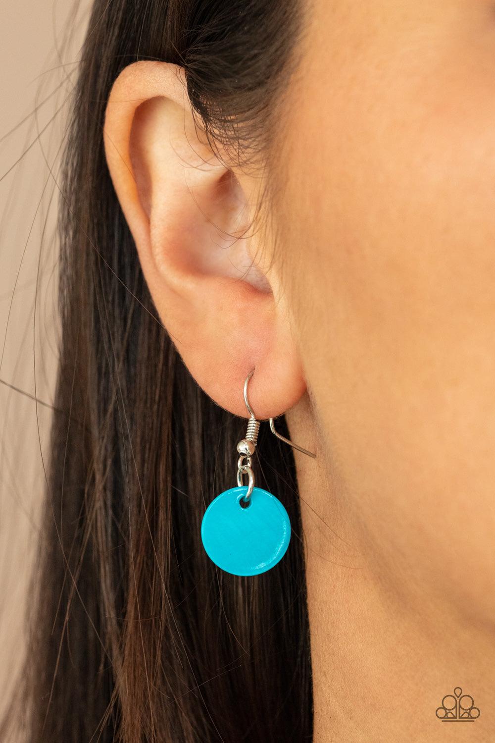 Paparazzi Accessories Tidal Tassels - Blue Featuring cylindrical silver accents, iridescent blue shell-like discs swing from the ends of knotted Ultimate Gray cords, creating a colorful tassel. Features an adjustable sliding knot closure. Sold as one indi