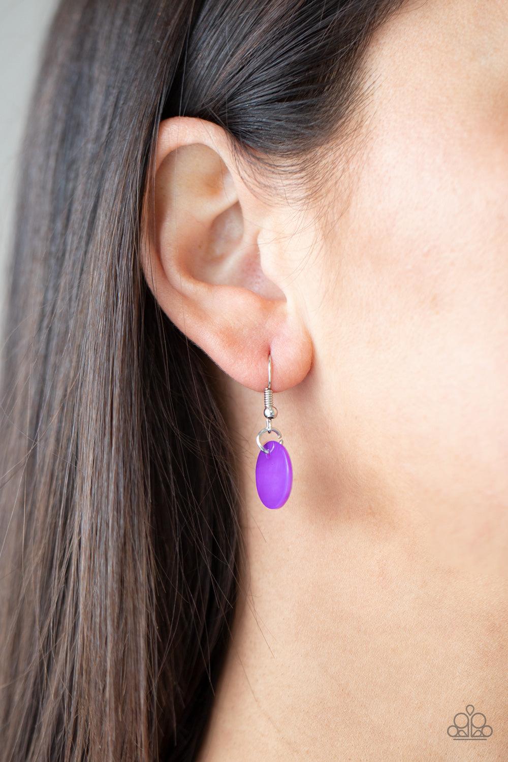 Paparazzi Accessories Tidal Tassels - Purple Featuring cylindrical silver accents, iridescent purple shell-like discs swing from the ends of knotted Ultimate Gray cords, creating a flamboyant tassel. Features an adjustable sliding knot closure. Sold as on