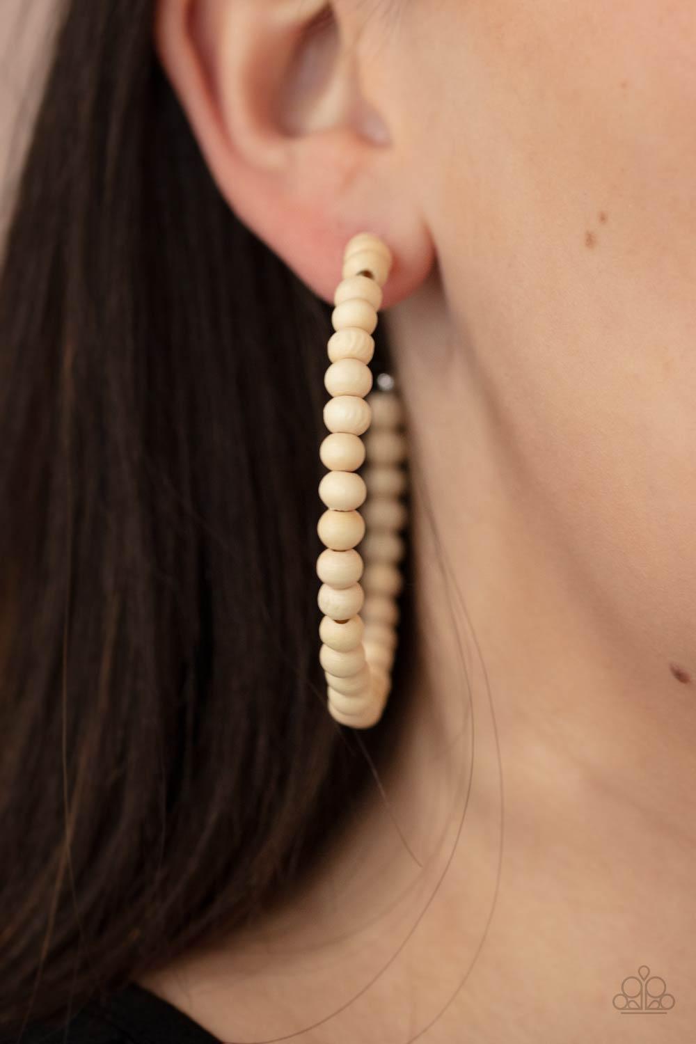 Paparazzi Accessories Should Have, Could Have, WOOD Have - White White wooden beads are threaded along a dainty wire, creating an earthy hoop. Earring attaches to a standard post fitting. Hoop measures approximately 2 1/2" in diameter. Sold as one pair of