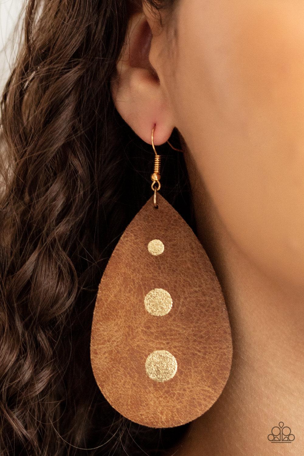 Paparazzi Accessories Rustic Torrent - Gold The front of a distressed leather teardrop frame is adorned into three glistening gold paint drops, creating a rustic elegance. Earring attaches to a standard fishhook fitting. Sold as one pair of earrings. Earr