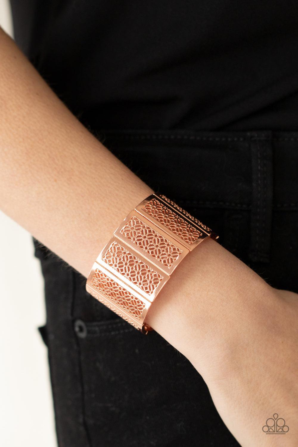 Paparazzi Accessories Thai Terrariums - Copper Filled with airy stenciled floral patterns, rectangular shiny copper frames are threaded along stretchy bands around the wrist, creating a whimsical centerpiece. Sold as one individual bracelet. Jewelry