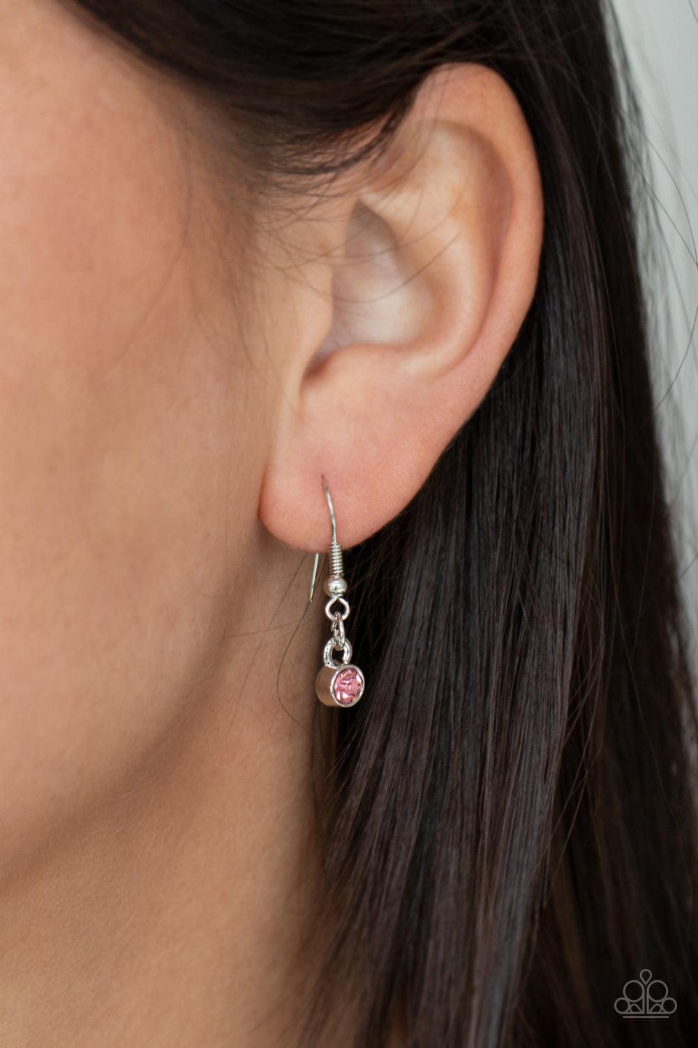 Paparazzi Accessories Mystical Majesty - Pink Featuring a mystical iridescence, a sparkling display of round cut pink gems are encased in delicately textured silver frames as they link below the collar, creating a majestic statement piece. Features an adj