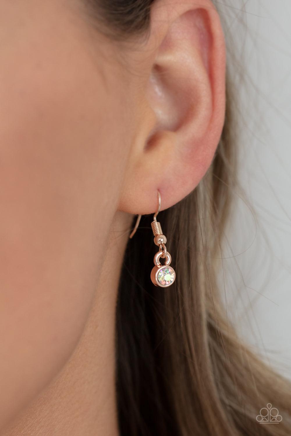 Paparazzi Accessories Cosmic Countess - Rose Gold Double stacks of iridescent oval cut gems link elegantly across the collar on a rose gold chain for a deliriously cosmic flair of glamour. Features an adjustable clasp closure. Sold as one individual neckl