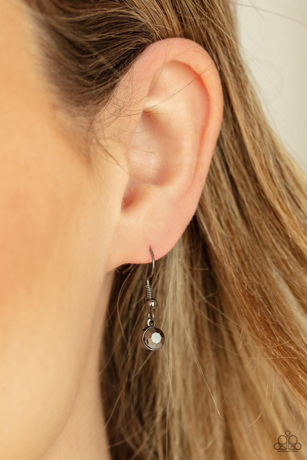 Paparazzi Accessories Cosmic Cocktail - Blue A glittery collection of raw cut blue gems delicately link with dainty hematite rhinestone dotted gunmetal teardrops below the collar, creating a stellar fringe. Features an adjustable clasp closure. Sold as on