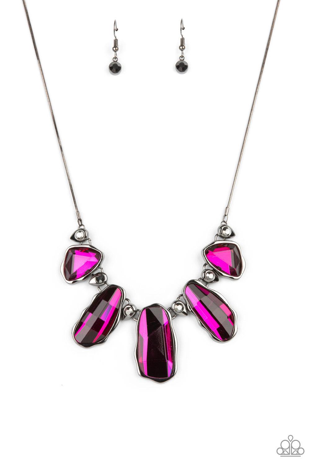 Paparazzi Accessories Cosmic Cocktail - Pink A glittery collection of raw cut pink gems delicately link with dainty hematite rhinestone dotted gunmetal teardrops below the collar, creating a stellar fringe. Features an adjustable clasp closure. Sold as on