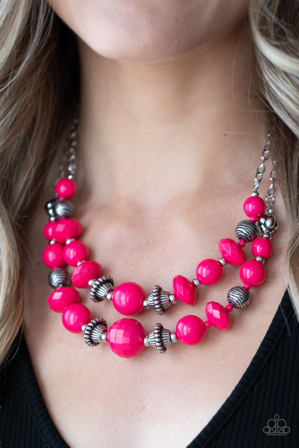Paparazzi Accessories Upscale Chic - Pink Bold yet whimsical, bright Raspberry Sorbet beads alternate with silver beads etched in a linear pattern along two strands for a vibrant statement below the collar. Features an adjustable clasp closure. Sold as on