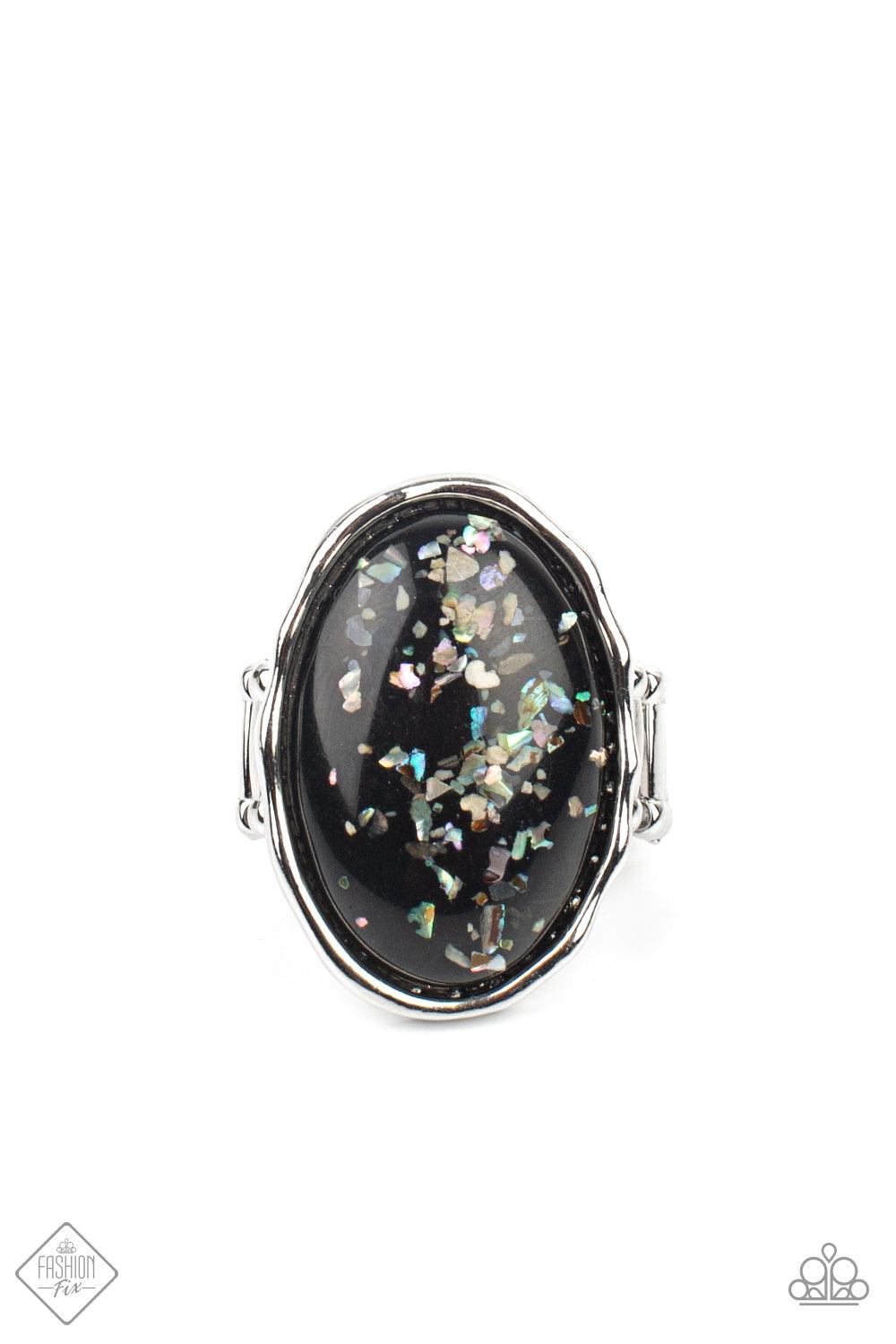 Paparazzi Accessories Glittery With Envy - Black Encased in an imperfectly hammered silver frame, flecks of shell-like pieces are encased inside an oversized glassy black bead for a bubbly effect. Features a stretchy band for a flexible fit. Sold as one i