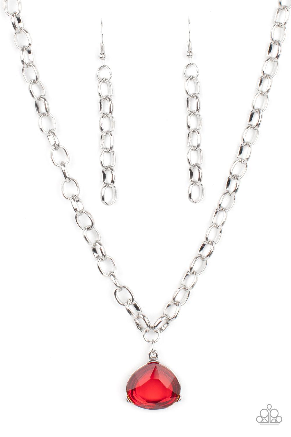 Paparazzi Accessories Gallery Gem - Red An oversized glassy red gem is pressed into a pronged silver fitting at the bottom of a chunky silver chain, creating a dramatic pendant below the collar. Features an adjustable clasp closure. Sold as one individual