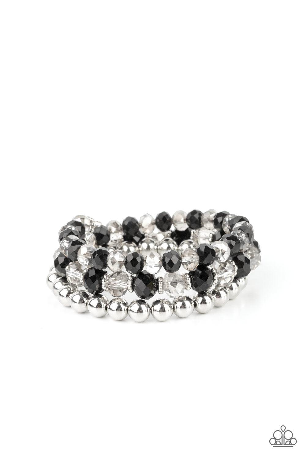 Paparazzi Accessories Gimme Gimme - Black Sections of shiny silver beads and an alternating pattern of smoky and glittery black rhinestone gems gradually increase in size along a coiled wire, creating a jaw-dropping infinity wrap bracelet around the wrist