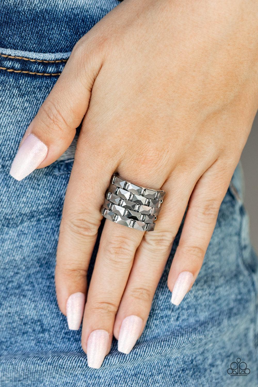 Paparazzi Accessories Checkered Couture - Silver Featuring a flashy faceted surface, staggered rows of rectangular hematite rhinestones alternate with shiny silver bar-like accents across a thick silver band for a gritty-glamorous statement atop the finge
