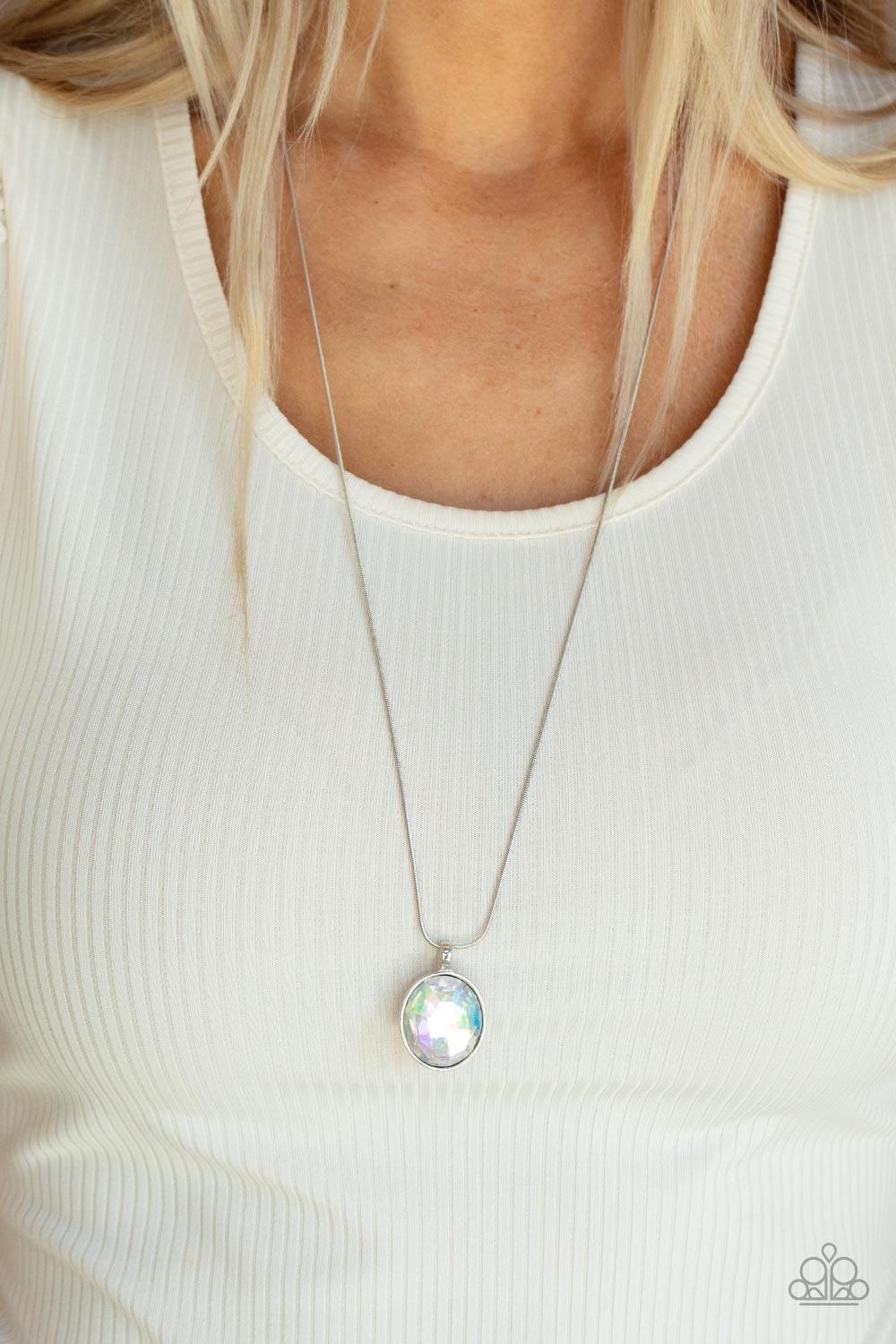 Paparazzi Accessories Instant Icon - Multi An oversized iridescent gem is pressed into the center of a sleek silver fitting, creating a mesmerizing statement piece at the bottom of a sleek silver chain. Features an adjustable clasp closure. Sold as one in